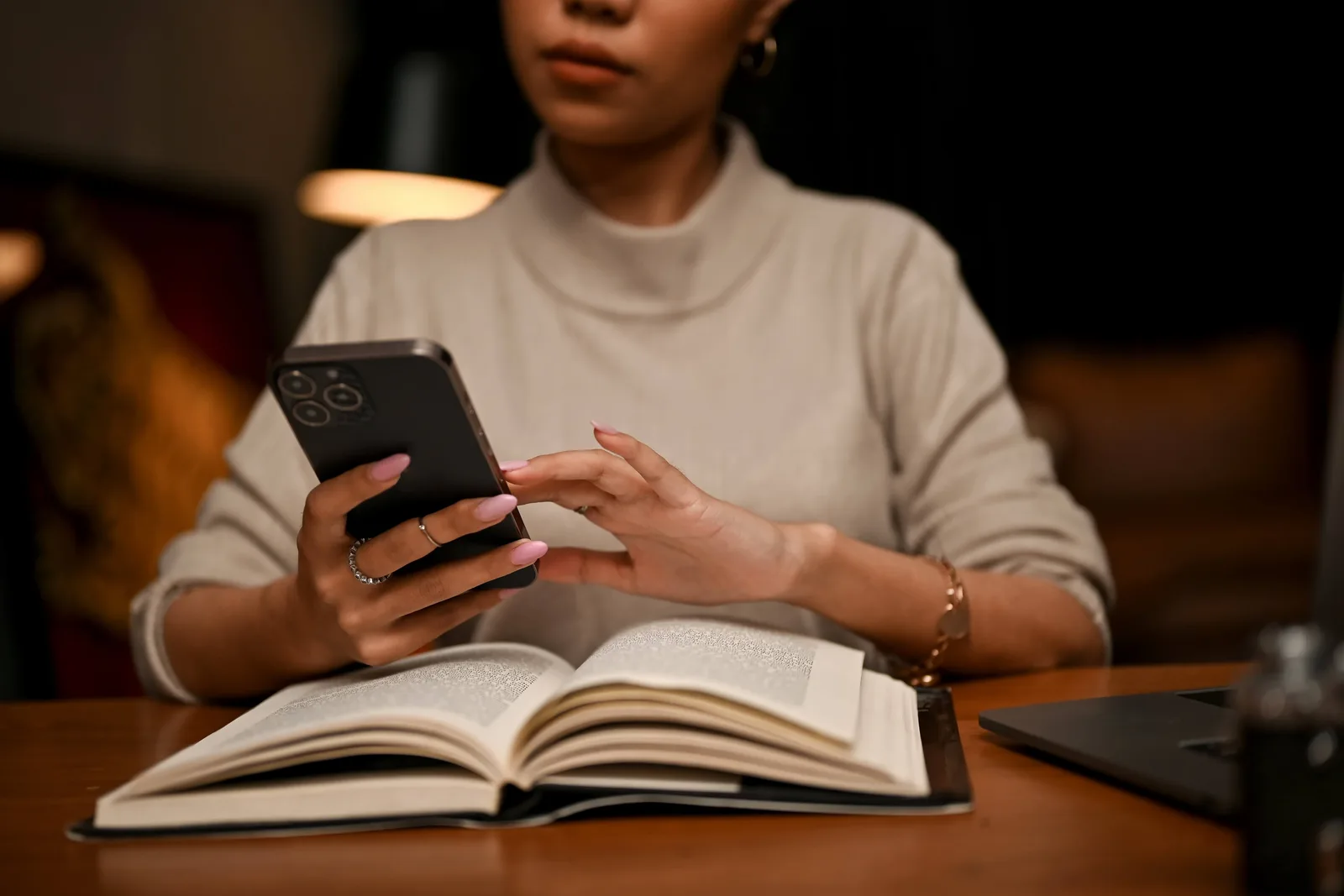 Female Using Her Smartphone while studying