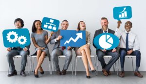 Diverse business people holding icons