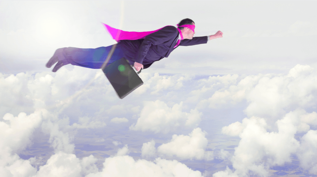 Businessperson in suit with pink cape flying through clouds, symbolizing bold action and innovation